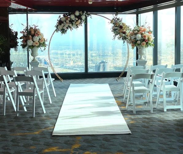 Ceremony Backdrop with Silk Florals, Urns, Americana Chairs and White Carpet Runner