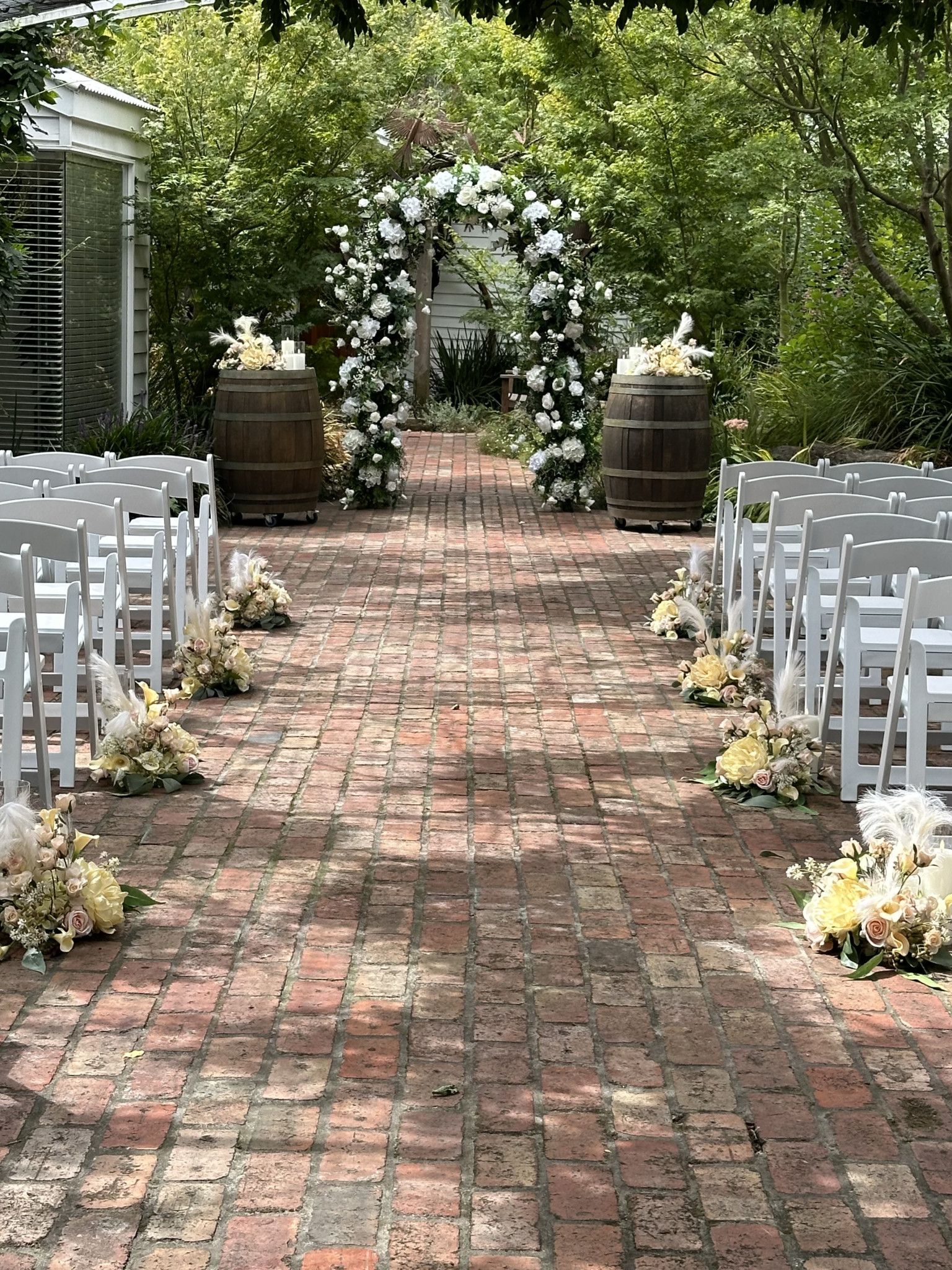 Wedding Ceremony Floral Arch, Wine Barrels, Silk Florals, Wedding Flowers, White Americana Chairs